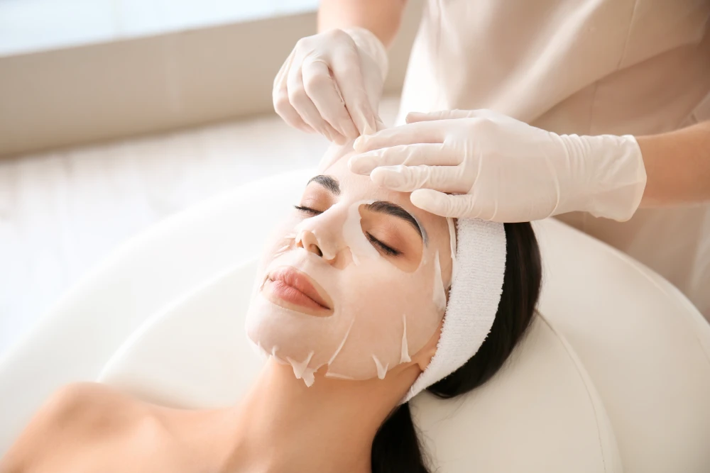 Facial mask treatment in a med spa setting.